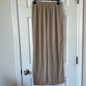 CLIO tan women pants pulled up size medium tall bootcut good condition